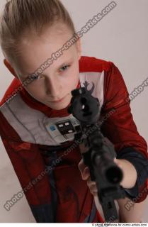 DENISA KNEELING POSE WITH GUN